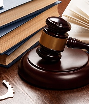 Gavel, books and handcuffs
