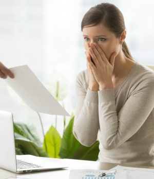 Employer giving dismissal notice to young woman